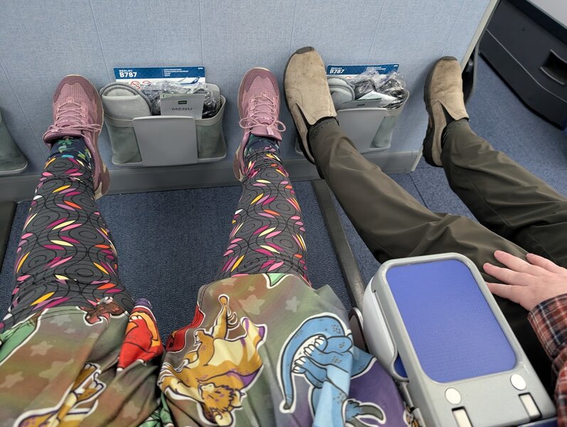 James and my legs stretched out all the way, just barely touching the wall in front of us
